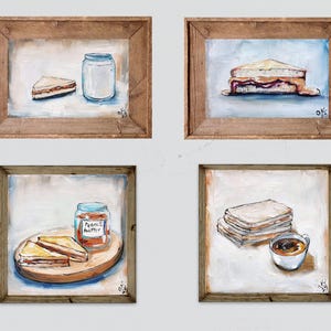May include: Four framed paintings depicting breakfast scenes. One shows a peanut butter sandwich and a jar. Another shows a peanut butter and jelly sandwich. The third shows a jar of peanut butter and two sandwiches on a wooden board. The last shows a stack of toast and a cup of coffee.