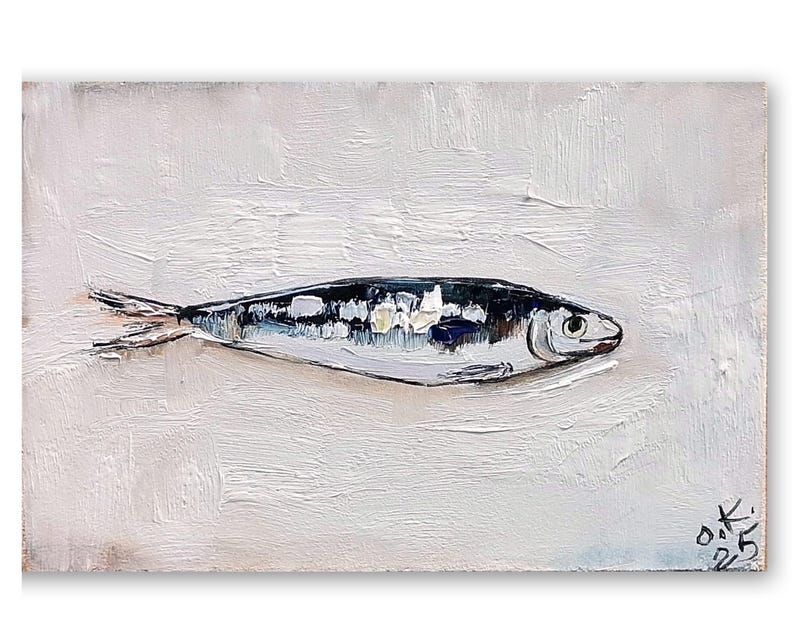 May include: Oil painting of a fish on a white background. The fish is painted in shades of black, white, and blue, with visible brushstrokes. The artwork is signed in the bottom right corner.