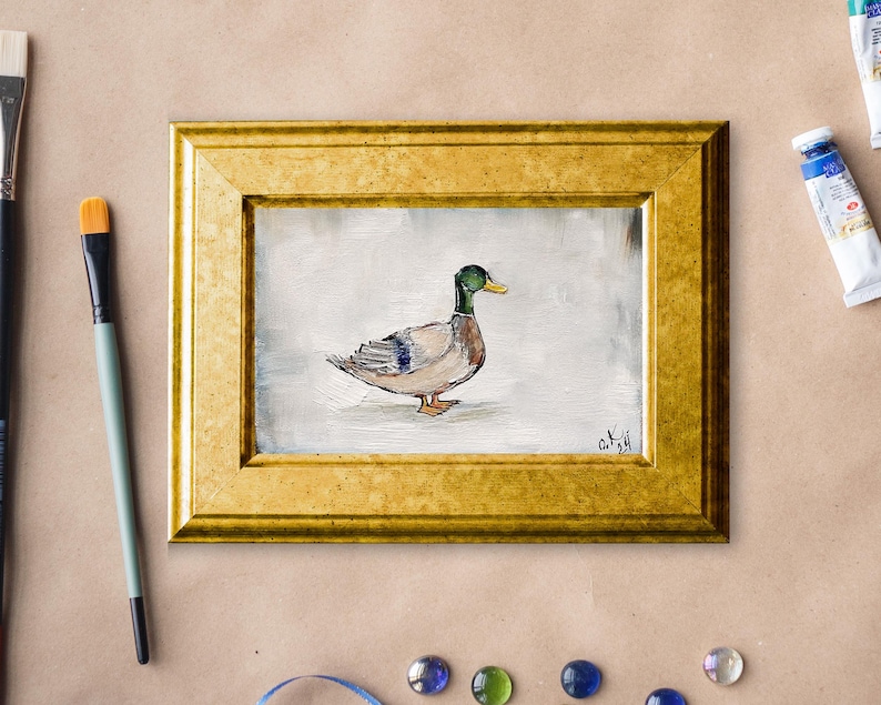 May include: A framed painting of a mallard duck with green head and brown feathers, set against a white background. Mallard duck painting original miniature art Vintage duck oil painting farmhouse kitchen wall art country decor duck hunting gift 4x6