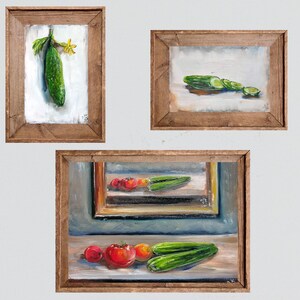 May include: Three framed oil paintings featuring fresh produce. One painting shows a whole cucumber with a yellow flower. Another depicts sliced cucumbers. The third painting displays tomatoes and cucumbers.