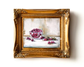 May include: A framed painting of a glass bowl filled with pink raspberries, with a few raspberries scattered on a white surface. The painting is set against a light beige background.