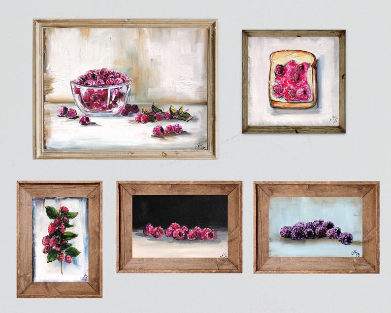 May include: A collection of framed art prints featuring still life paintings of raspberries. The artwork includes a bowl of raspberries, a slice of toast with jam, and close-ups of the fruit. The paintings are in wooden frames.