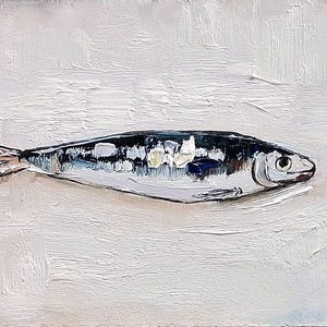 May include: Oil painting of a fish on a white background. The fish is painted with shades of gray, black, and white, with a touch of blue. The artwork has a textured, impasto style, with visible brushstrokes. The artist's signature and the number "25" are in the bottom right corner.