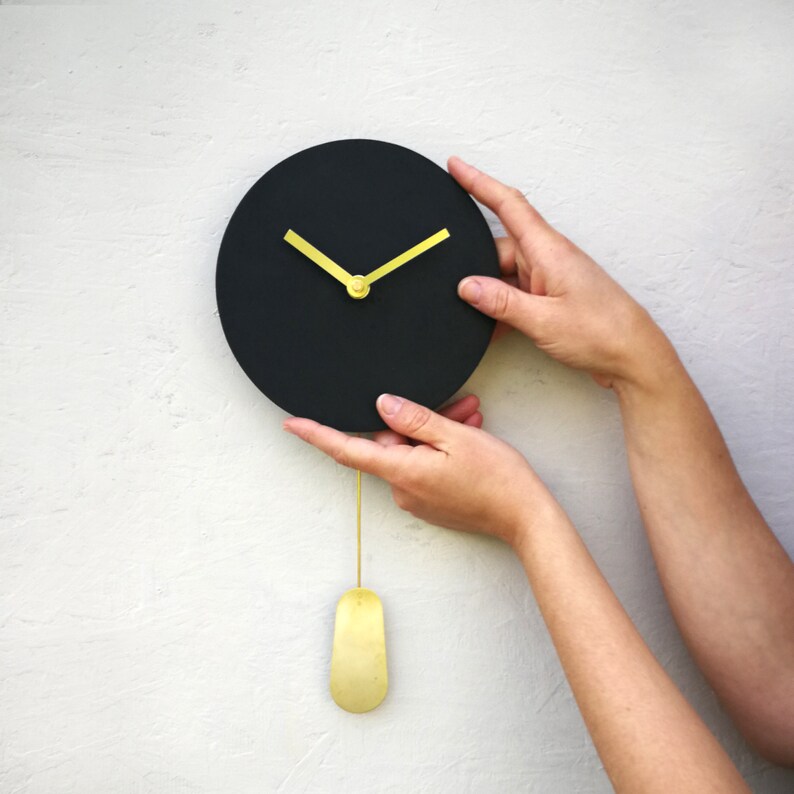 Small Black Pendulum Wall Clock With Gold Hands No Numbers Etsy