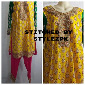 May include: A yellow embroidered tunic and pink pants set with green sleeves. The tunic features intricate gold and red embroidery around the neckline and on the front. The text "STITCHED BY STYLEZPK" is visible.