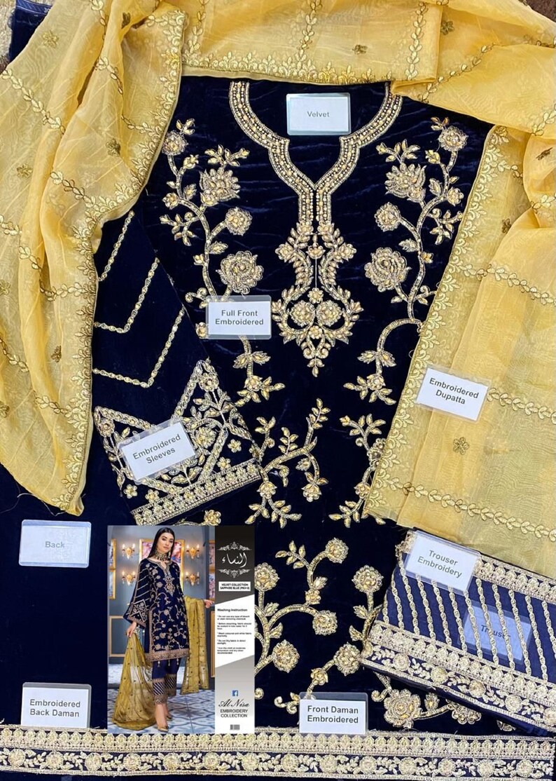 May include: Navy blue velvet embroidered outfit with gold floral detailing. Includes an embroidered dupatta and trouser embroidery. The outfit features text labels: "Full Front Embroidered", "Embroidered Sleeves", "Embroidered Back Daman", and "Front Daman Embroidered".