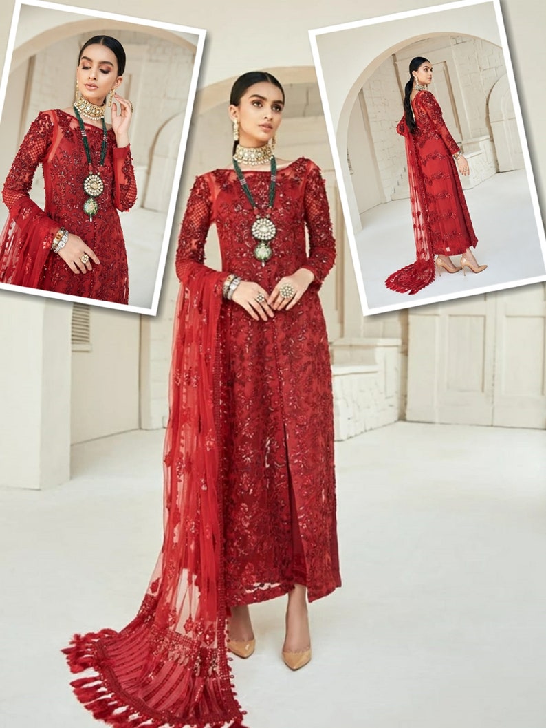 May include: A red, long-sleeved formal dress with intricate embroidery and a flowing train. The dress features a high neckline and is adorned with embellishments. The ensemble includes a matching sheer scarf. The model is wearing jewelry and heels.