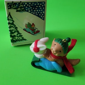 AVON WINTER PALS~Tree Ornament In Original Box From 1984•Bunny & Squirrel On A Green Sled~Vintage 1984