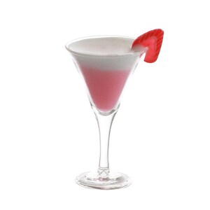 May include: A pink and white layered cocktail in a martini glass with a red candy garnish.