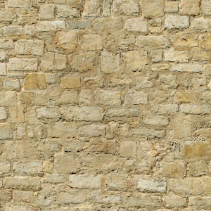 May include: A close-up of a stone wall with a rough, textured surface. The wall is made of irregular shaped stones in shades of beige, brown, and grey.