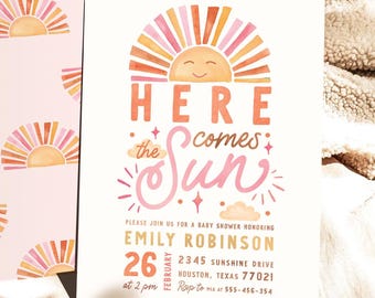 May include: A baby shower invitation featuring a pink and orange sun graphic. The text reads "Here comes the sun" and includes the date, time, and location of the event.