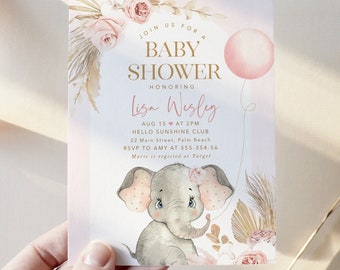 May include: A pink and gold baby shower invitation with a watercolor illustration of an elephant holding a pink balloon. The invitation reads "Join us for a Baby Shower Honoring Lisa Wesley Aug 15 at 2PM Hello Sunshine Club 22 Main Street, Palm Beach RSVP to Amy at 555-354-56 Maris is registered at Target"