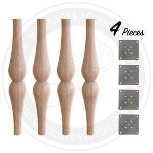 May include: Set of four wooden table legs with a turned design. Each leg has a rounded top and bottom. The set also includes four metal mounting plates with screw holes.