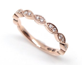 Diamond ring in red gold with 18 diamonds, 14K rose gold ring with 0,18ct diamonds in multi navette ring by goldsmith Torbjörn Grönlund