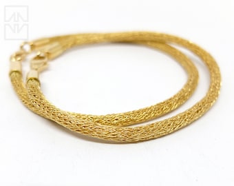 Knitted 750 gold bracelets, handmade 18K gold arm jewelry, precious gold jewelry by Marcel Meier from Berlin-Mitte