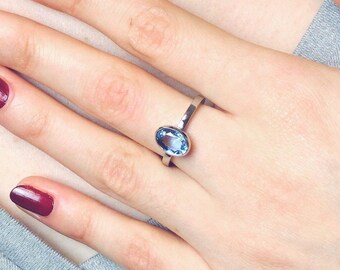 Plain palladium ring with oval aquamarine, aquamarine ring in size 55, solitaire ring with light blue gemstone by Torbjörn Grönlund