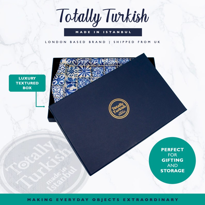May include: A blue and white ceramic serving tray with a geometric pattern is displayed in a navy blue box with gold lettering that reads "Totally Turkish made in Istanbul". The box is closed and the lid is open, revealing the tray inside. The box has a gold logo that reads "Totally Turkish made in Istanbul".