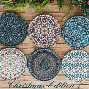 May include: Six decorative ceramic plates with intricate blue, red and white patterns. The plates feature a variety of geometric and floral designs.