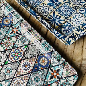 May include: Two rectangular trays with a colorful geometric pattern. The trays are made of metal and have a glossy finish. The pattern is reminiscent of traditional tile designs.