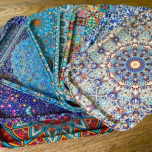 May include: A set of six colorful trays with intricate geometric patterns. The trays are made of a durable material and are perfect for serving snacks, drinks, or other items.