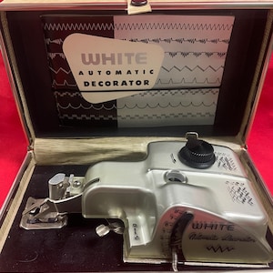 White Sewing Machine Automatic Decorator.