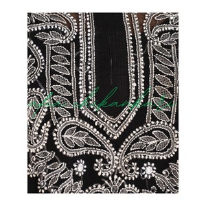 May include: Black fabric with white embroidery featuring paisley and floral patterns. The embroidery is detailed and intricate.