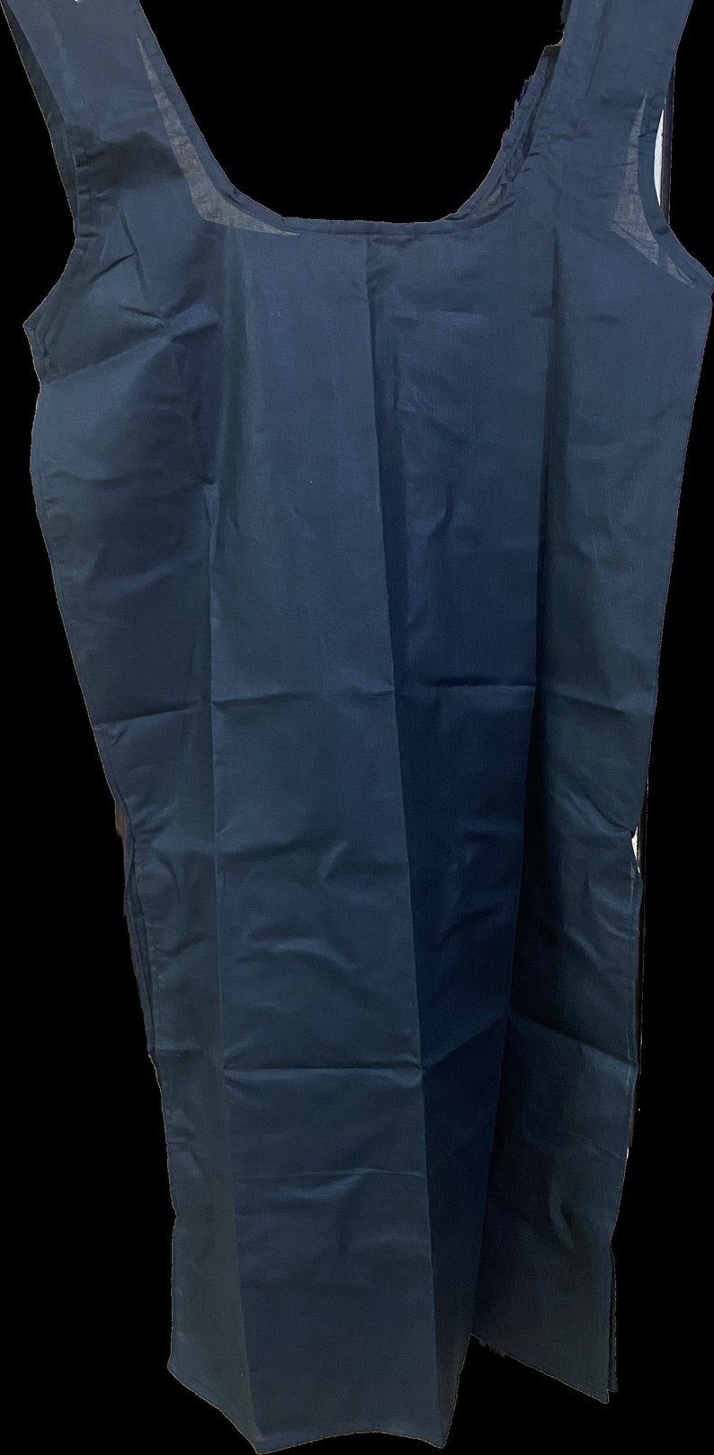 May include: A dark blue sleeveless tunic top with a scoop neck.