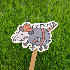 Opossum Cowboy Stay Strapped Possum Vinyl Sticker | Original Creator | Water Resistant Sticker for Laptops, Water Bottles, and Notebooks