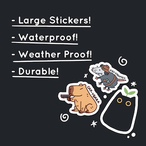 May include: Four illustrated stickers featuring a capybara holding a gun, a possum wearing a cowboy hat and holding a gun, a black cat with a green plant growing on its head, and a swirl design. The stickers have white borders and are on a black background. The text on the stickers reads "Cap-Ybarra", "Stay Strapped", and "Weather Proof!"