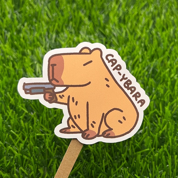 Bust a Cap-ybara Capybara Gun Vinyl Sticker | Original Creator | Water Resistant Sticker for Laptops, Water Bottles, and Notebooks