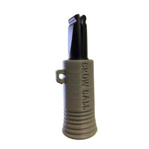 May include: A gray and black crow call with the text "CROW CALL" printed vertically on the side. The call has a cylindrical body with a flared base and a black mouthpiece.