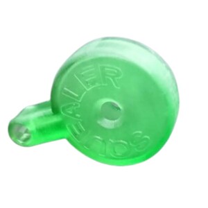 May include: A translucent green plastic whistle with the word "SQUAWKER" embossed on the side. The whistle has a rounded body and a small mouthpiece. The object is isolated on a white background.