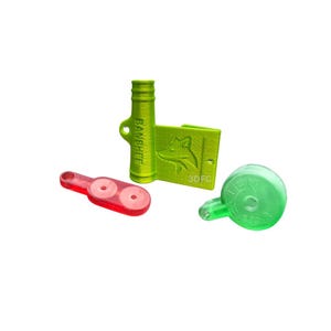 May include: A collection of 3D-printed accessories in bright colors. Includes a red piece with two holes, a green cylinder with "BANSHEE" text, a green rectangular piece with a fox logo and "3DFC" text, and a green circular piece with text.