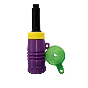 May include: A purple and black hunting call with a yellow band that reads "SO-FOX". A green tuning key is included. The call has the word "TERMINATOR" printed on it.