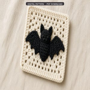 May include: A rectangular off-white crochet granny square featuring a black bat appliqué centered on the surface. The top of the image includes a black rectangular label with the white text DIGITAL PATTERN • PDF DOWNLOAD.