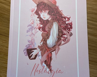 May include: A pink book cover featuring an illustration of a woman with long red hair wearing a brown witch's hat and a brown dress. She is holding a potted plant. The book title is "Nostalgia" and the subtitle is "Mixed Media Collection Suri I Julia Salm".