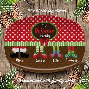 May include: Oval serving platter with a red polka dot pattern and green and white stripes. The platter features family names and festive legs. The text reads "The DeCanio Family" and "Personalized with family name."