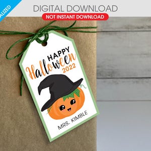 May include: A printable Halloween gift tag featuring a cute pumpkin wearing a witch's hat. The tag is green and white with the text "Happy Halloween 2022" and "Mrs. Kimble".
