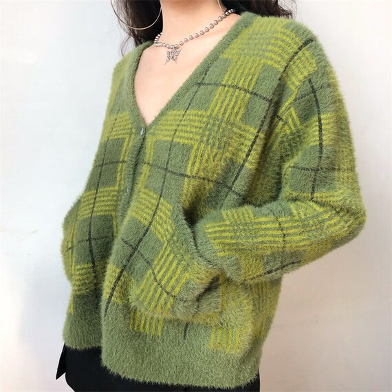 green fuzzy sweater