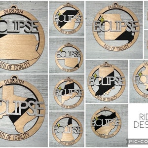 May include: A collage of 10 round wooden ornaments with a black and gold design. Each ornament features a different state silhouette with the text "ECLIPSE" and "PATH OF TOTALITY". The date "04.08.2024" is printed on each ornament. The text "RIDAL DESIGNS" and "PIC COLLAGE" are printed at the bottom of the collage.