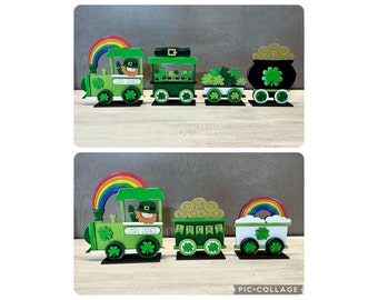 May include: A green and gold wooden train with a rainbow, leprechaun, pot of gold, and shamrock decorations. The train cars say "Lucky Express" and "Lucky".