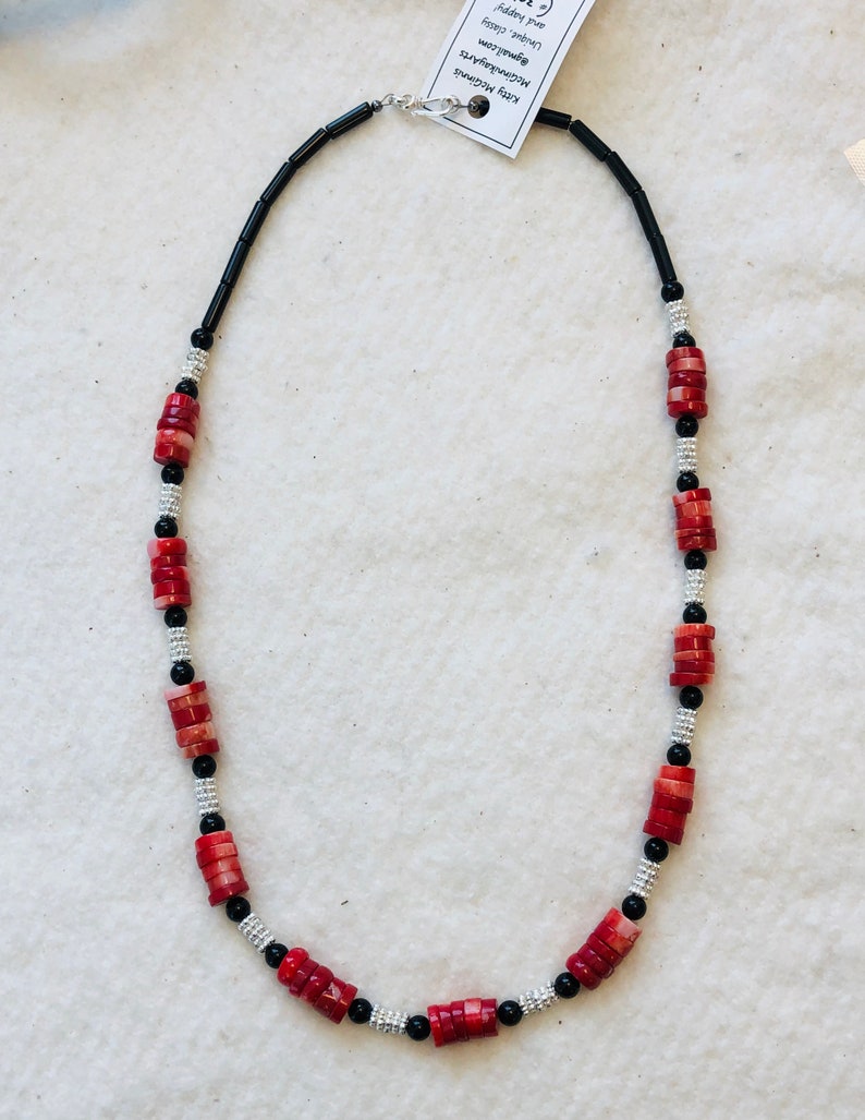 Simple but elegant coral and onyx with sterling silver clasp