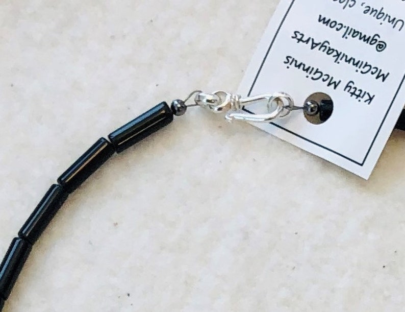 Simple but elegant coral and onyx with sterling silver clasp
