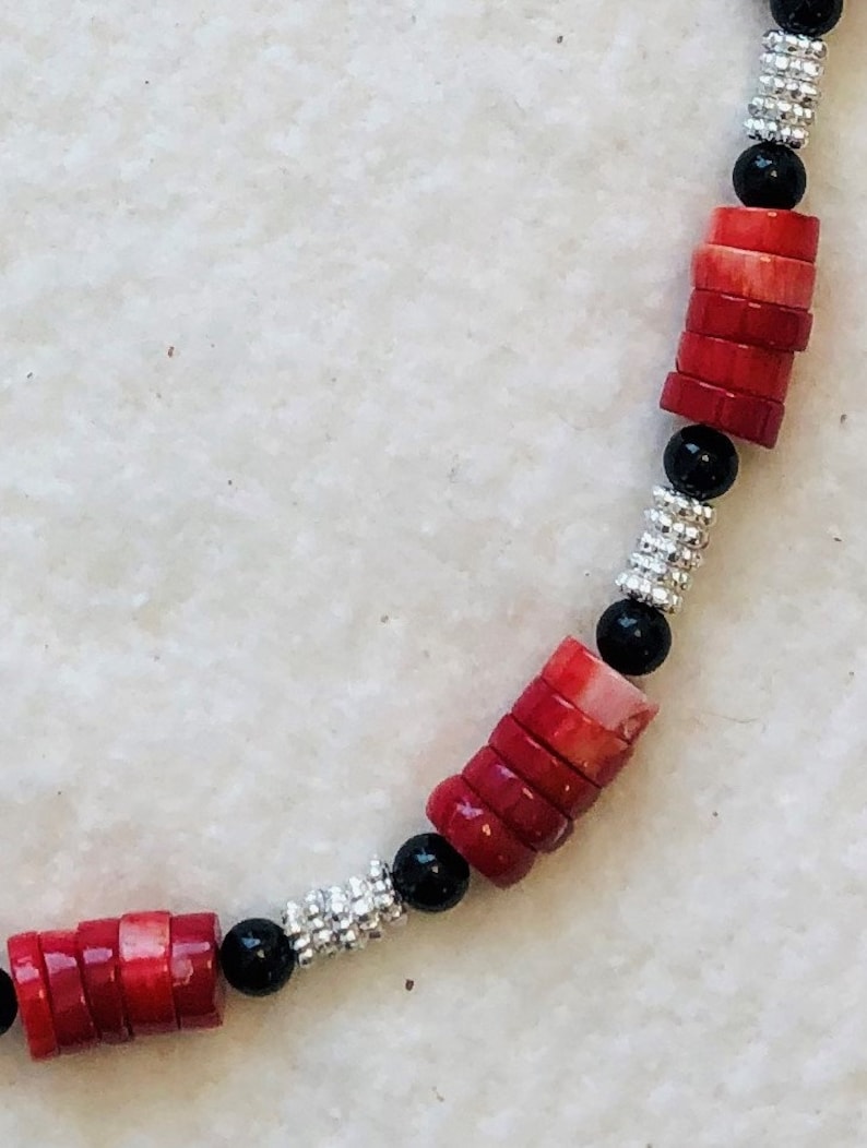 Simple but elegant coral and onyx with sterling silver clasp