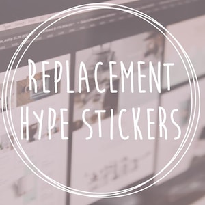 May include: A computer screen shows a design with the text "REPLACEMENT HYPE STICKERS" in a white, handwritten-style font, encircled by a white outline. The background is a soft, muted pink.