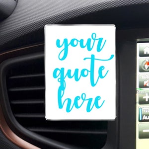 May include: White car air freshener with a blue inscription that reads "your quote here".
