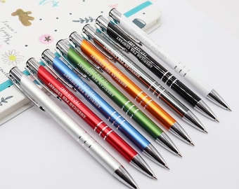 May include: A set of ten ballpoint pens with silver accents. The pens are arranged in a row, with the tips pointing to the right. The pens are all different colors: silver, red, blue, green, orange, black, and white. Each pen has the text "AMERICAN PEN COMPANY" and a phone number printed on the side.