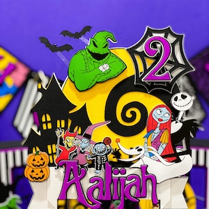 May include: A Nightmare Before Christmas themed cake topper with a green Oogie Boogie, a black and white Jack Skellington, a red and white Sally, a purple number 2, a black and white Zero, and a white banner with the name "Aaliyah".
