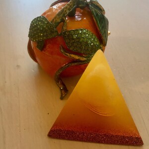 Pyramid glows in the dark, playful energy of orange calcit