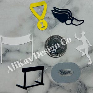 May include: A set of black and white track and field themed paper cutouts. The set includes a finish line, a hurdle, a running shoe, a runner, a medal, and a circle.